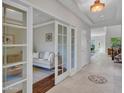 Bright hallway showcasing decorative tile flooring, modern lighting, and an open doorway to a living room at 5137 W Quail Track Dr, Phoenix, AZ 85083