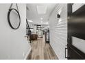 Inviting entryway with modern black accents, a stylish mirror, and bright interior views at 6207 N 10Th Way, Phoenix, AZ 85014