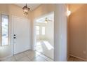 Inviting foyer with tile flooring and views of the living area at 6450 S Windstream Pl, Chandler, AZ 85249