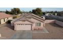 Well-maintained single-story home featuring a two-car garage and neutral-toned exterior at 1624 W Minton St, Phoenix, AZ 85041