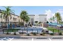 Resort-style community pool with lounge chairs, shaded seating, and lush landscaping, perfect for relaxation at 651 N Ironwood Dr # 1, Apache Junction, AZ 85120
