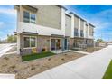 Contemporary townhome showcasing modern design, private patio spaces, and well-maintained landscaping at 651 N Ironwood Dr # 1, Apache Junction, AZ 85120