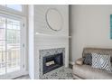 Close-up of the fireplace with a unique tile surround and stylish mantel at 7675 E Mcdonald Dr # 222, Scottsdale, AZ 85250