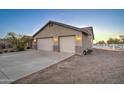 Exterior of large garage with two doors and stucco siding at 12326 N Lang Rd, Florence, AZ 85132