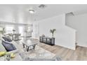 Open-concept living room with a seamless flow into the dining area and kitchen, ideal for entertaining at 197 E Douglas Ave, Coolidge, AZ 85128