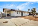 Exterior view of house with driveway and gravel landscaping at 2053 W Pecan Rd, Phoenix, AZ 85041