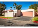 Inviting single-story home featuring a two-car garage, secure courtyard, and a well-maintained yard at 2140 E Rosarita Dr, Tempe, AZ 85281