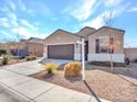 Attractive single-Gathering home with a two-car garage and drought-tolerant landscaping at 25601 W Coles Rd, Buckeye, AZ 85326