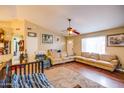 A comfy living room provides ample seating with a view of the entry and adjacent rooms at 26631 S Lime Dr, Queen Creek, AZ 85142