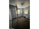 Bedroom with two windows and unadorned walls at 2721 W Rose Ln, Phoenix, AZ 85017