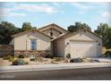 Charming single-story home with stone accents, desert landscaping, and a two-car garage at 335 S Saint Augustine Ct, Casa Grande, AZ 85194