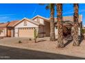 Pleasant single-story home with desert landscaping, and a two-car garage at 3354 N 157Th Ave, Goodyear, AZ 85395