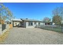 Single-story home with gravel yard, carport, and tidy landscaping at 3714 E Polk St, Phoenix, AZ 85008