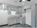 Updated kitchen with modern countertops and stainless steel hood vent at 3714 E Polk St, Phoenix, AZ 85008