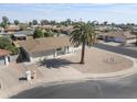 Expansive aerial view showcases the home's tidy landscaping, neighborhood, and adjacent street at 4662 E Escondido Ave, Mesa, AZ 85206