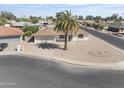 An elevated view of a single-story home showcasing its landscaping, neighborhood setting, and surrounding street at 4662 E Escondido Ave, Mesa, AZ 85206