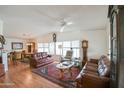 Spacious living room featuring hardwood floors, classic furnishings, and abundant natural light at 5735 E Mcdowell Rd # 447, Mesa, AZ 85215