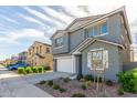 Modern gray homes with well-maintained landscaping along a quiet street at 9303 E Static Ave, Mesa, AZ 85212