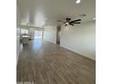 Open-concept living space featuring stylish tile flooring, recessed lighting, and a ceiling fan at 10281 W Concordia Dr, Arizona City, AZ 85123