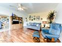 Cozy living room featuring light-colored walls, hardwood floors, and a comfortable seating arrangement at 17200 W Bell Rd # 26, Surprise, AZ 85374