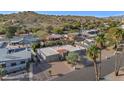 An aerial view of a home with a red tile roof nestled in a desert landscape and mountain views at 17309 E Rosita Dr, Fountain Hills, AZ 85268