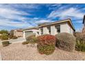 Single story home with desert landscaping and a well-maintained front yard at 21919 N Bradford Dr, Maricopa, AZ 85138