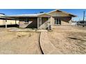 A single-story home featuring a pathway leading to the main entrance at 2201 N 35Th Dr, Phoenix, AZ 85009