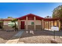 Charming single-story home with brick accents, desert landscaping, and covered carport at 2205 E Linda Ct, Phoenix, AZ 85022