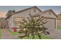 Charming home featuring a well-manicured lawn, desert landscaping, and a two-car garage at 3147 E Michigan Ave, Phoenix, AZ 85032