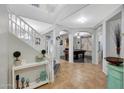 Inviting entryway with tile floors, staircase, and arched doorways leading to other living spaces at 3553 N 292Nd Dr, Buckeye, AZ 85396