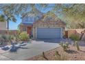 Attractive home featuring desert landscaping and a two-car garage with stone accents at 3553 N 292Nd Dr, Buckeye, AZ 85396