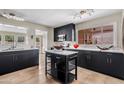 Modern kitchen featuring black cabinets, white countertops, and stainless steel appliances at 3718 E Sheridan St, Phoenix, AZ 85008