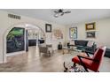 Open-concept living area with tile floors, modern lighting, and seamless flow to the kitchen at 3718 E Sheridan St, Phoenix, AZ 85008