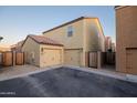 Rear garage with multiple parking spaces and exterior lighting at 3911 S 79Th Ln, Phoenix, AZ 85043