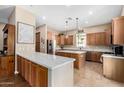 Spacious kitchen showcasing quartz countertops, ample cabinetry, stainless appliances, and a large island at 4217 E Edgemont Ave, Phoenix, AZ 85008