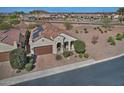 Aerial shot of a home with solar panels, landscaping, and a beautiful desert community view at 4424 N Potomac Dr, Florence, AZ 85132