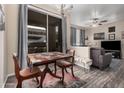 Charming dining area with a colorful table setting and natural light at 5303 N 7Th St # 114, Phoenix, AZ 85014