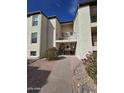 Multi-level apartment complex with stairs and landscaping at 5518 E Lindstrom Ln # 3012, Mesa, AZ 85215