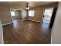 Spacious living room with wood-look floors, great natural light, and neutral paint at 619 W Cocopah St, Phoenix, AZ 85003