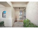 Inviting entryway with textured walls and a decorative front door at 6315 E Kelton Ln, Scottsdale, AZ 85254