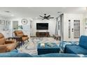 Comfortable living room featuring stylish decor and seamless flow into adjacent kitchen at 6420 N 85Th Pl, Scottsdale, AZ 85250