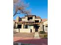 Stylish two-story home with stone accents and a welcoming pergola-covered entryway at 804 W Village Pkwy, Litchfield Park, AZ 85340