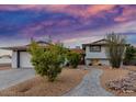 Home features low maintenance landscaping and updated exterior paint at 8602 E Mitchell Dr, Scottsdale, AZ 85251