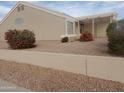 Tan single-story home featuring low maintenance desert landscaping at 11184 W Royal Palm Rd, Peoria, AZ 85345