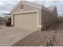 Attached two car garage with mature landscaping including river rock at 11184 W Royal Palm Rd, Peoria, AZ 85345