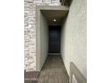 Welcoming entryway featuring a modern front door and a paved pathway leading to the entrance at 17916 W Puget Ave, Waddell, AZ 85355