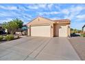 Charming single-Gathering home featuring a three-car garage and beautiful desert landscaping at 21500 N 262Nd Ln, Buckeye, AZ 85396