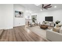 Open living room featuring modern decor, a ceiling fan and luxury vinyl flooring at 2305 S Orange --, Mesa, AZ 85210