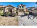 A two-story home with a large front window, a small balcony, and neat landscaping at 2738 W Silver Fox Way, Phoenix, AZ 85045