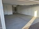 Attached garage offering a secure parking space and extra room for storage at 3646 E Roland St, Mesa, AZ 85215